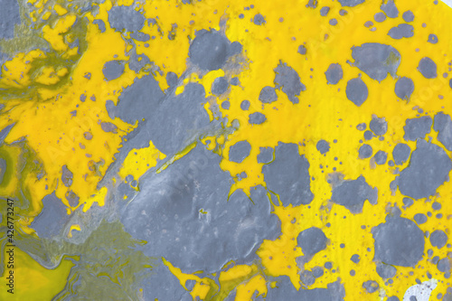 Gray-yellow abstract art background with acrylic paints. Fluid art texture. The trending colors of 2021 are ultimate gray and illuminating. Modern background of mixed colors for the design websites © Anna Pismenskova