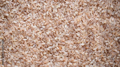 Raw whole dried Matta red parboiled rice photo
