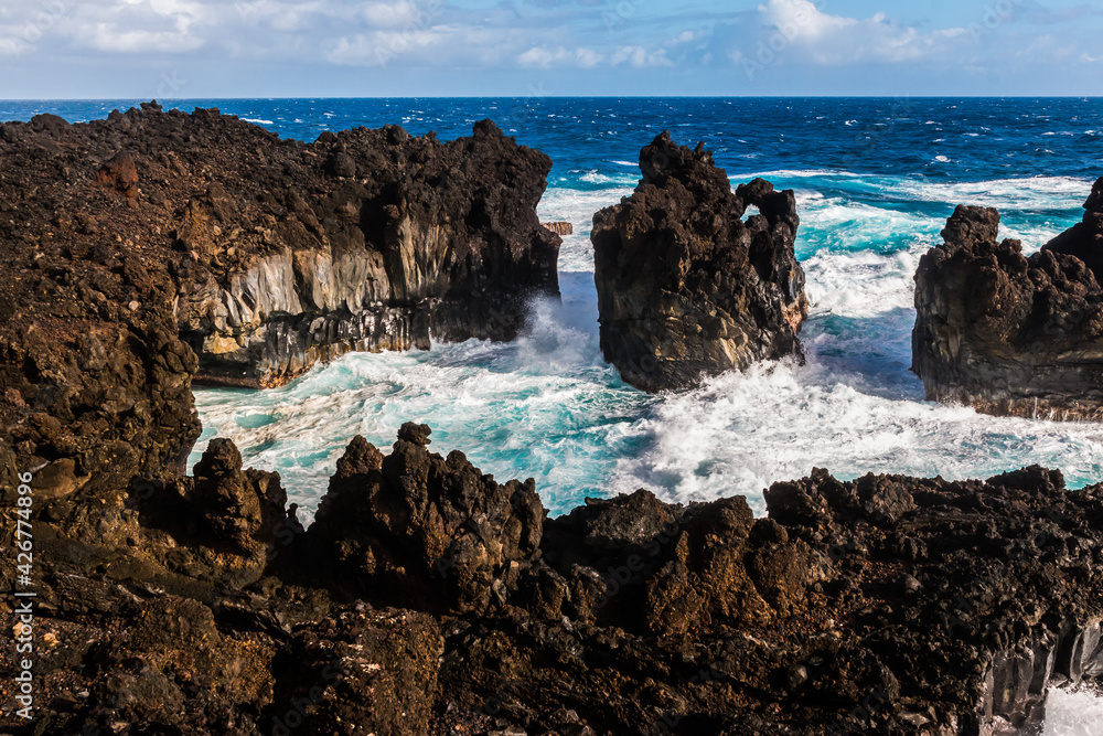 Waves Crashing Against The Black Basalt Lava Shelf at Pakulua Point, Waianapanapa State Park, Maui, Hawaii, USA