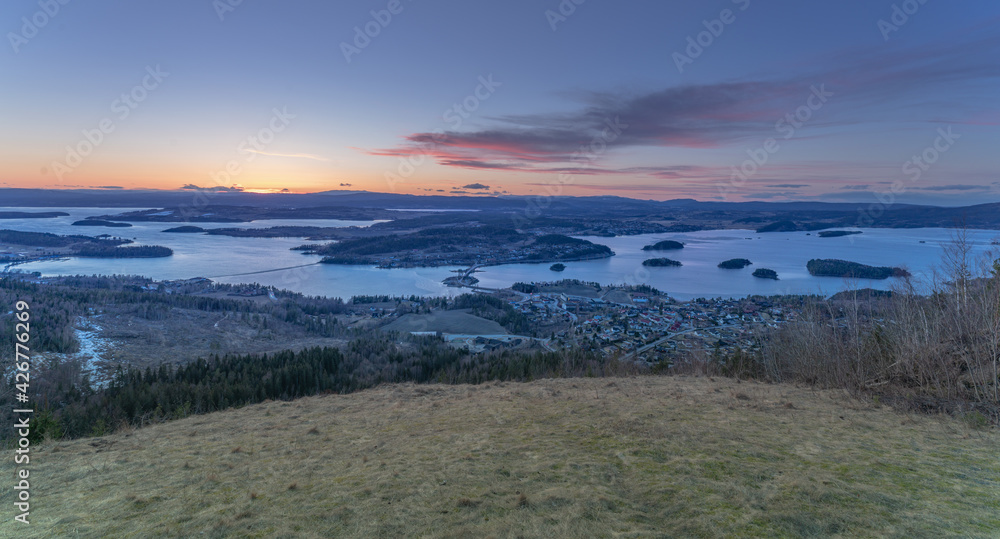 Sunset over Steinsfjorden, a branch of Lake Tyrifjorden located in Buskerud, Norway. View from Kongens Utsikt (Royal View) at Krokkleiva