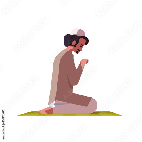 religious muslim man kneeling and praying on carpet ramadan kareem holy month religion concept flat full length