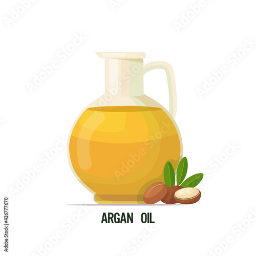 fresh argan oil glass bottle with seeds and leaves isolated on white background