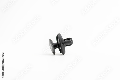 Black rivet plastic isolated on white background, used to fix workpiece to car