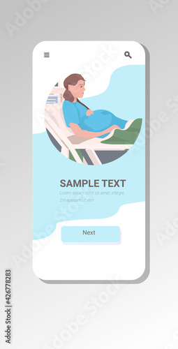 pregnant woman lying in hospital bed before childbirth maternity pregnancy concept smartphone screen mobile app vertical copy space portrait