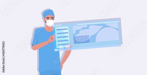 male doctor surgeon in uniform using virtual reality screen modern digital equipment medicine healthcare concept portrait horizontal