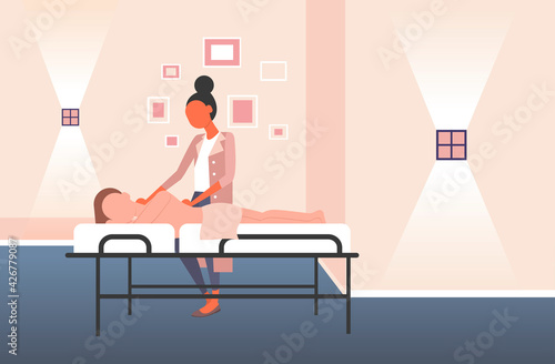 woman receiving body contouring masseuse makes anti cellulite relaxing procedures skin care massage therapy concept modern spa salon interior horizontal full length