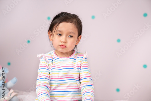 Little girl looking sad..