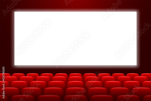 Cinema hall with white screen and red chairs