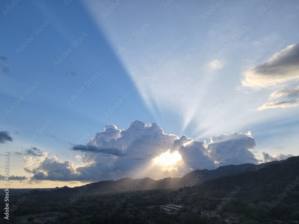 sunset in the mountains with cloud halo