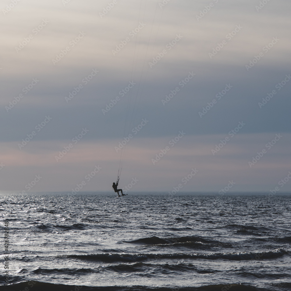 silhouetted Kite surfer in the water