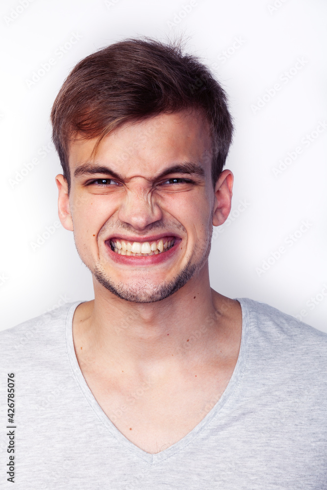 young handsome teenage hipster guy posing emotional, happy smiling against white background isolated, lifestyle people concept young handsome teenage hipster guy posing emotional, happy smiling against white background isolated, lifestyle people concept