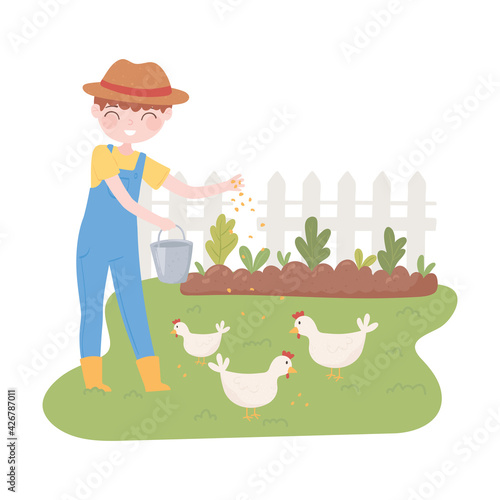 farmer feeding chickens