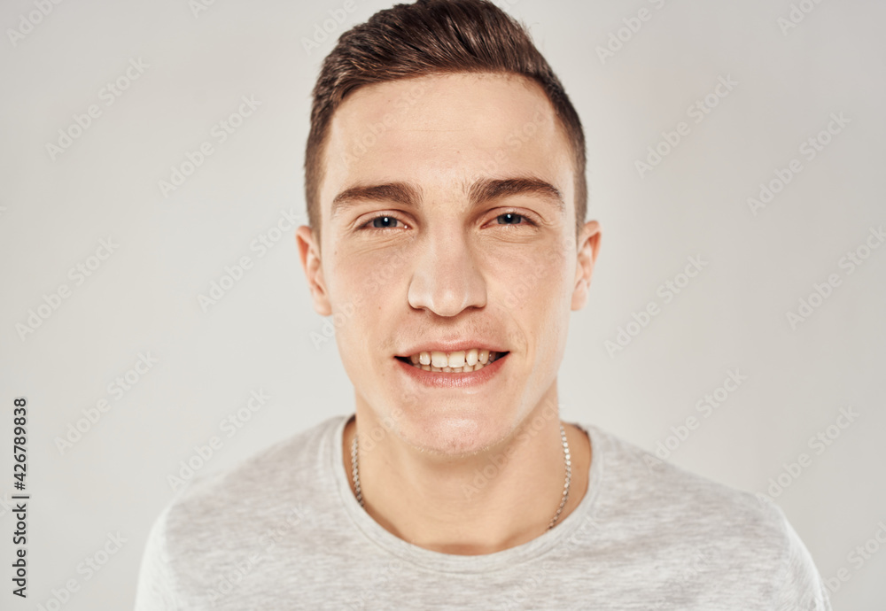 Fototapeta premium handsome man fun in white t-shirt close-up emotions