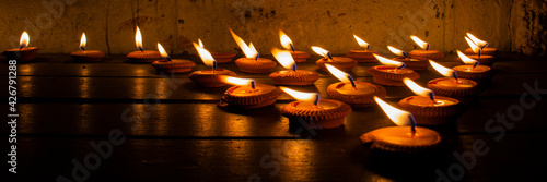 Canvas Print Light a candle on the floor, Concept of mourning the dead with warm candles