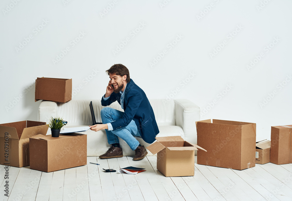business man sitting on the couch talking on the phone box official business man sitting on the couch talking on the phone box official
