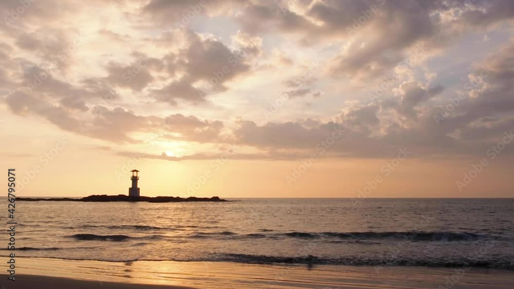 Dramatic Sunset over Storm Clouds sea beach. beautiful orange color sunset sky.  The landscape of Storm clouds against the setting sun. sunray beams shine through gray clouds covering the sun.