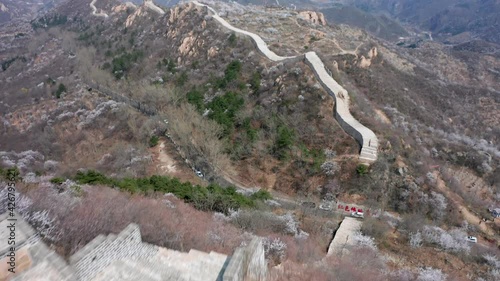Aerial photograph of the winding ancient Great Wall in spring mountain area of Beijing