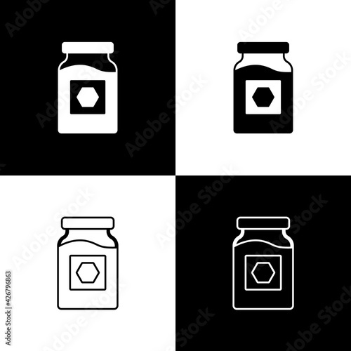 Set Jar of honey icon isolated on black and white background. Food bank. Sweet natural food symbol. Vector