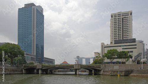View of the Coleman Bridge on the Singapore River. On the bridge  pedestrians  on the river ship