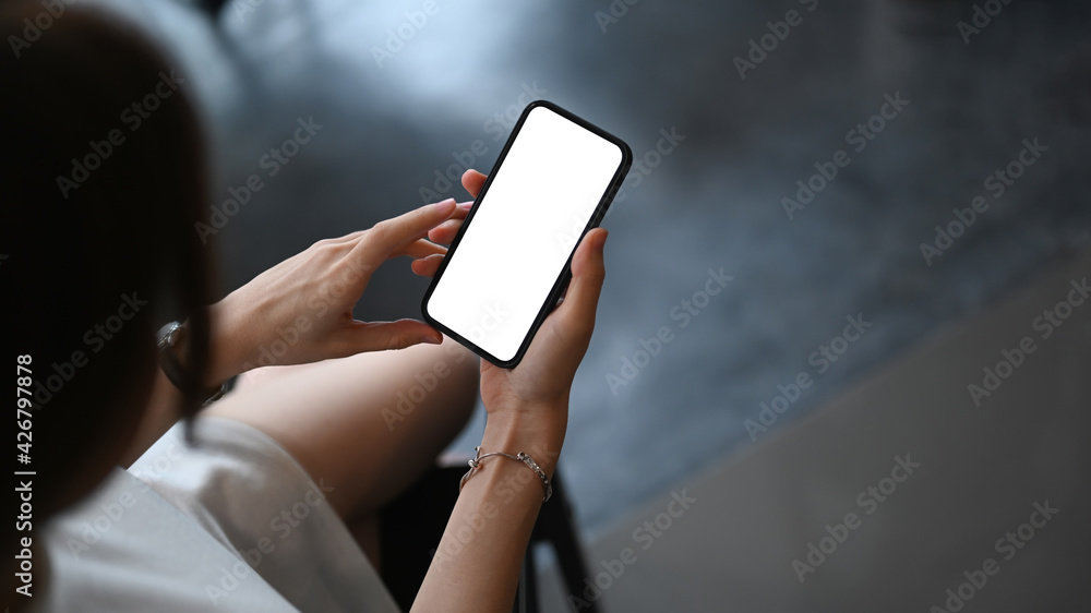 Close up view of businesswoman sitting in dark room and using smear phone. Close up view of businesswoman sitting in dark room and using smear phone.