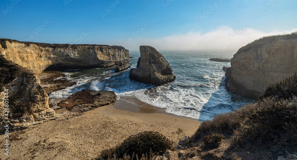 Shark fin cove, beautiful beach landscape on the coast of the California Highway, ocean, rocks, great sky, clear sunny weather.