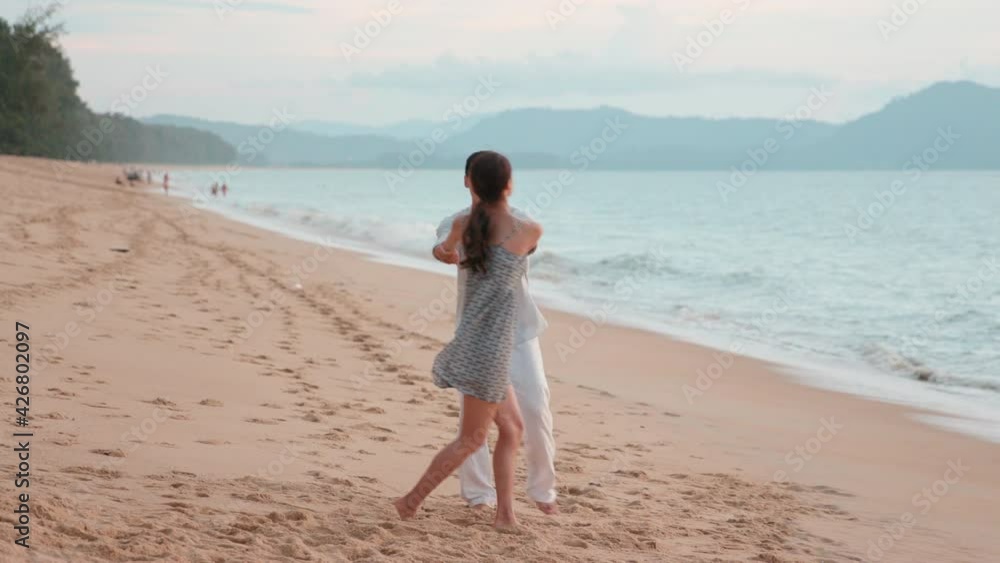 Happy young Chinese couple dating on beach,4K Happy young Chinese couple dating on beach,4K