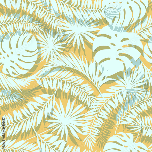 Vector summer seamless pattern : light blue big tropical palm leaves with shadows on warm beige sand background. Flat design art for textile , wallpaper, wrapping paper, notebook cover about vacations