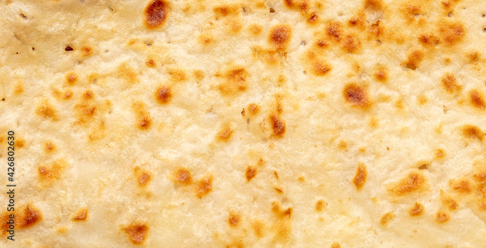 Fried pancake as an abstract background.