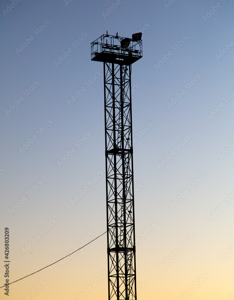 Metal TV tower at sunset. background Metal TV tower at sunset. background
