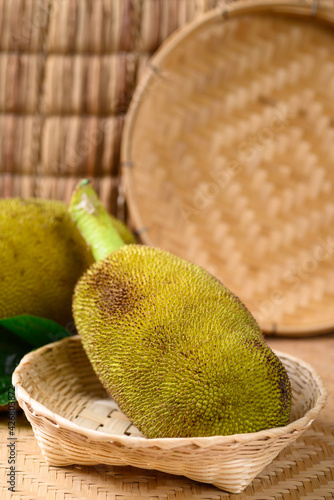 Fotografie Young jackfruit in a bamboo basket, Food ingredient in Southeast Asia cuisine