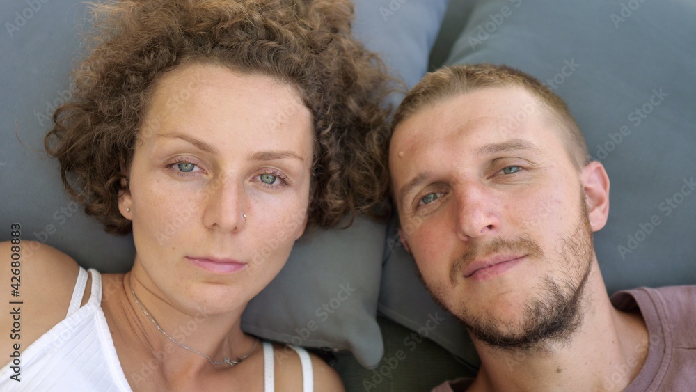 Portrait of young caucasian couple staring to the camera. Portrait of young caucasian couple staring to the camera.