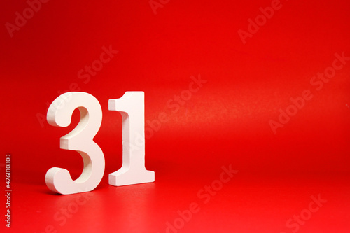 Thirty one ( 31 ) white number wooden Isolated Red Background with Copy Space - New promotion 31% Percentage Business finance Concept 