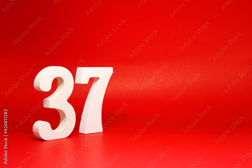 Thirty Seven ( 37 ) white number wooden Isolated Red Background with Copy Space - New promotion 37% Percentage Business finance Concept Thirty Seven ( 37 ) white number wooden Isolated Red Background with Copy Space - New promotion 37% Percentage Business finance Concept