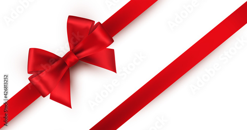 Shiny red satin ribbon on white background