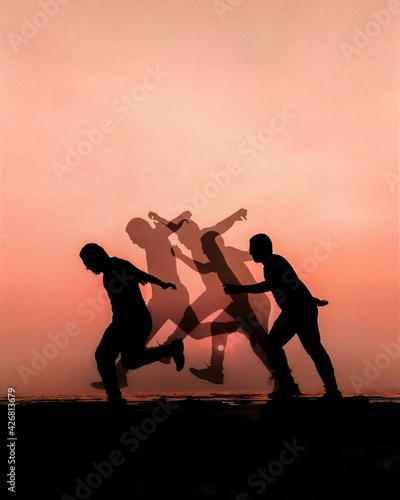 silhouettes of jump of aboy