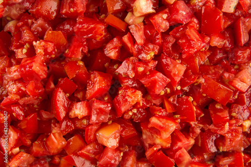 Closeup on red chopped tomato pattern texture background