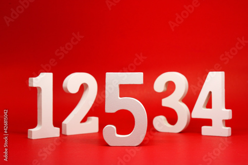 Konstfotografi Counting numbers ( 1 2 3 4 5 ) white number wooden on Red Background with Copy S