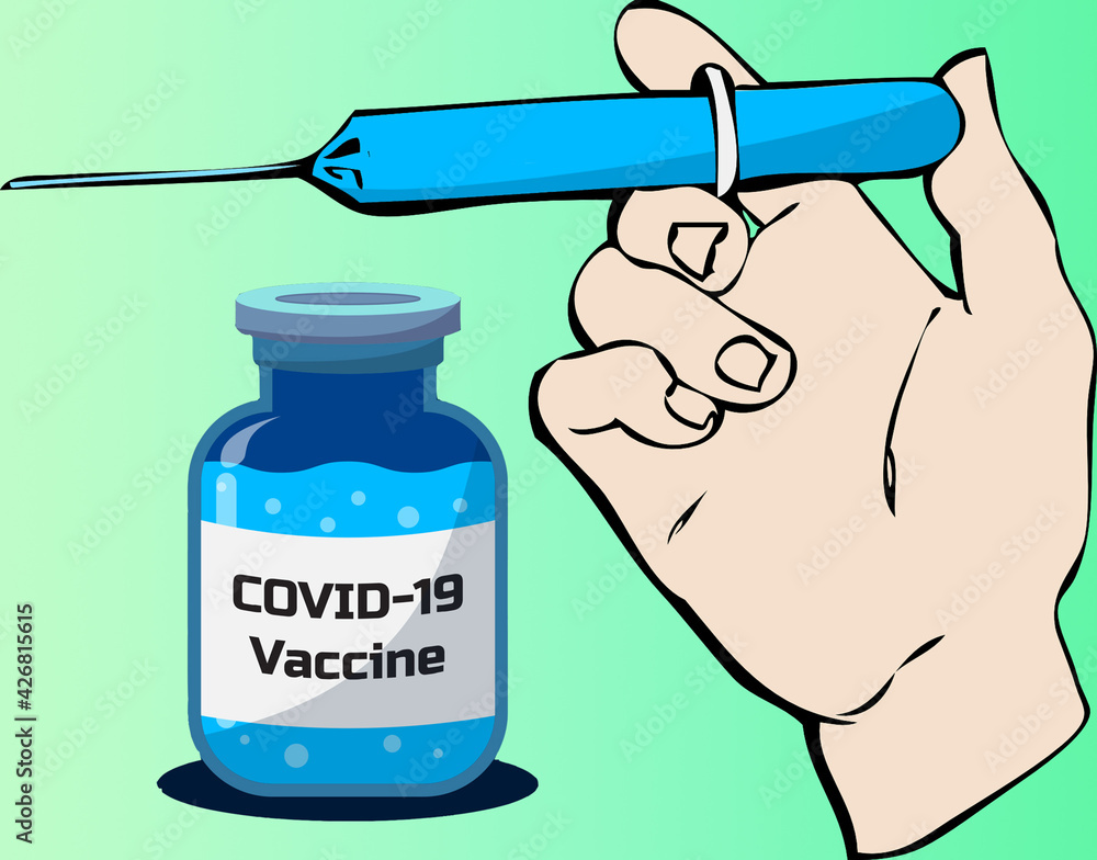 Hand holds a syringe with Covid-19 virus vaccine. Hand holds a syringe with Covid-19 virus vaccine.