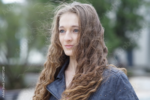 Portrait of a young beautiful girl in the park