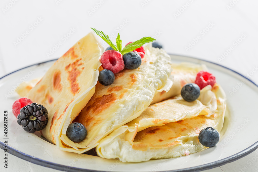Pancakes with cottage cheese, berries and sugar. Pancakes for breakfast.