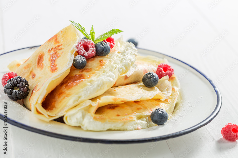Tasty pancakes with cottage cheese and berries. Pancakes for breakfast.