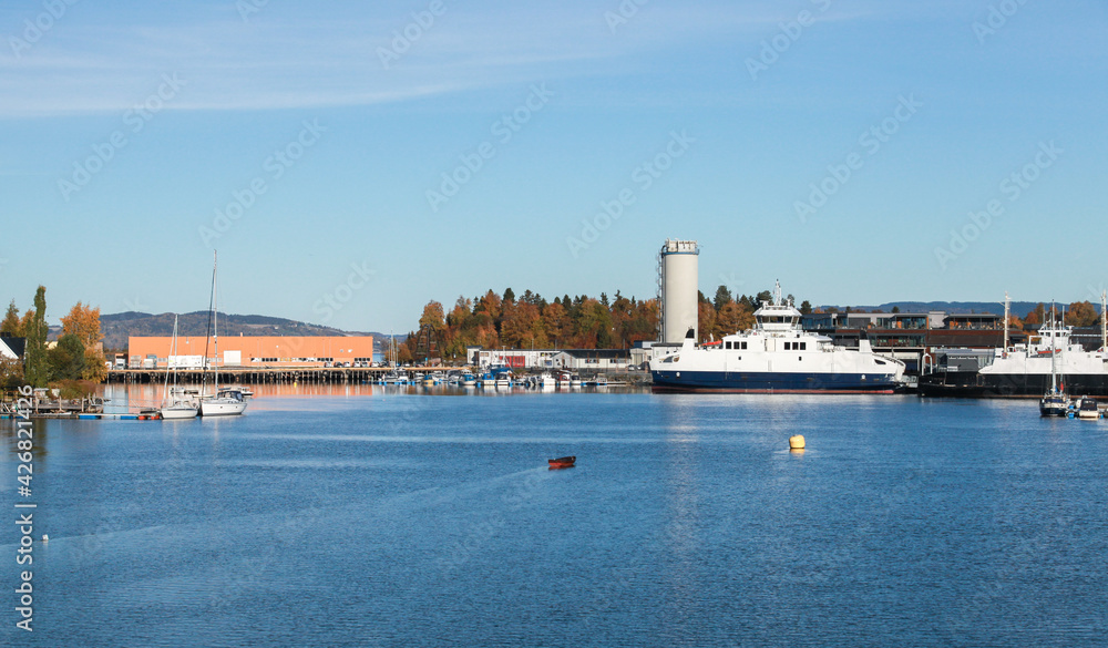 Boats and ferries moored at small Norwegian town