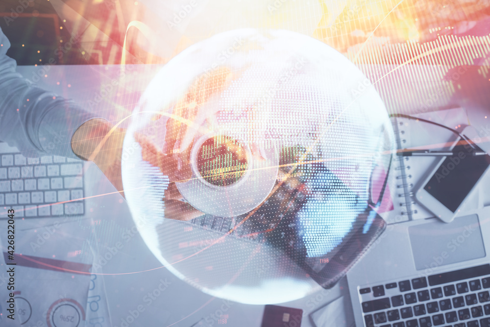Double exposure of man and woman working together and business theme hologram drawing. Computer background. Top View. Double exposure of man and woman working together and business theme hologram drawing. Computer background. Top View.
