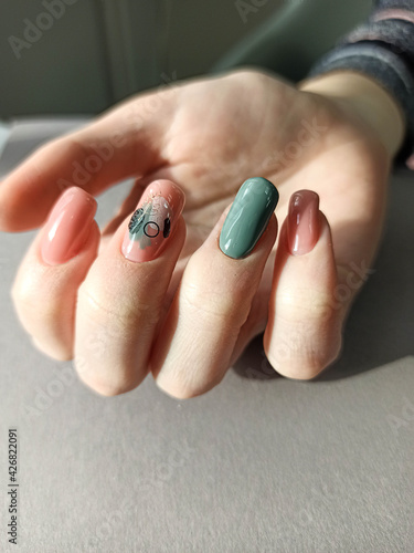 Female hands with nail design. Manicure and Hands Spa. . Beauty treatment. Beautiful woman's nails with beautiful baby boomer manicure copy space for. Manicured nails and Soft hands skin . Closeup	