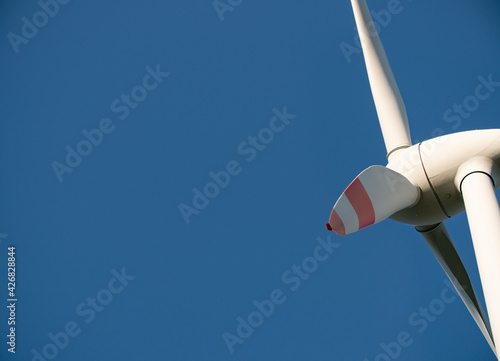 Extreme close-up of rotor blades from the wind turbine. Clear blue sky. 