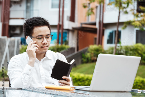 Business Concept - Young Business man woking on Financial plan. Strategy Analysis photo