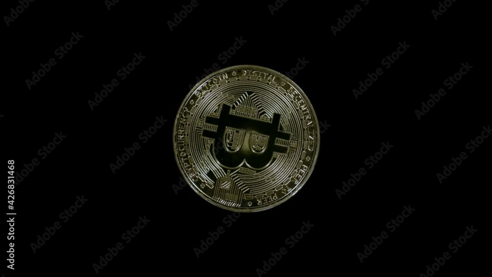 Golden color, metallic Bitcoin coin is glitters in the rays of light. Hodl, Hodler - Internet meme, slang name for those who buy cryptocurrencies and hold them. Macro. Closeup Golden color, metallic Bitcoin coin is glitters in the rays of light. Hodl, Hodler - Internet meme, slang name for those who buy cryptocurrencies and hold them. Macro. Closeup