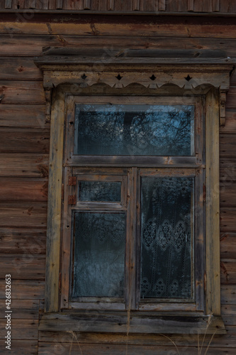 The window of an old wooden house.
