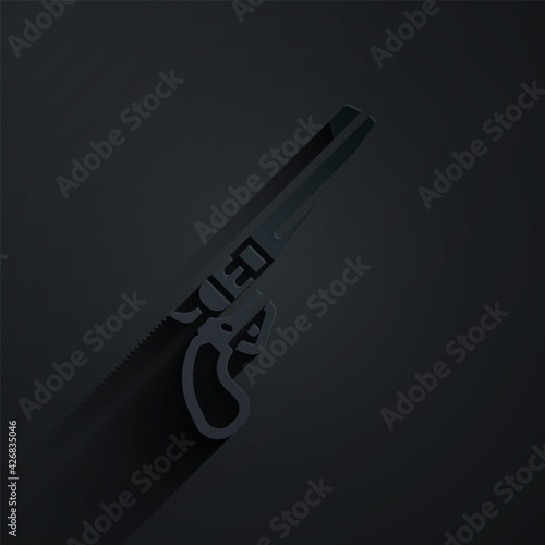 Paper cut Revolver gun icon isolated on black background. Paper art style. Vector