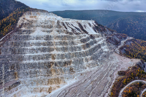 Surroundings of Lake Baikal. Khamar-Daban ridge. Gorge of Slyudyanka river. Marble quarry. Aerial view. photo